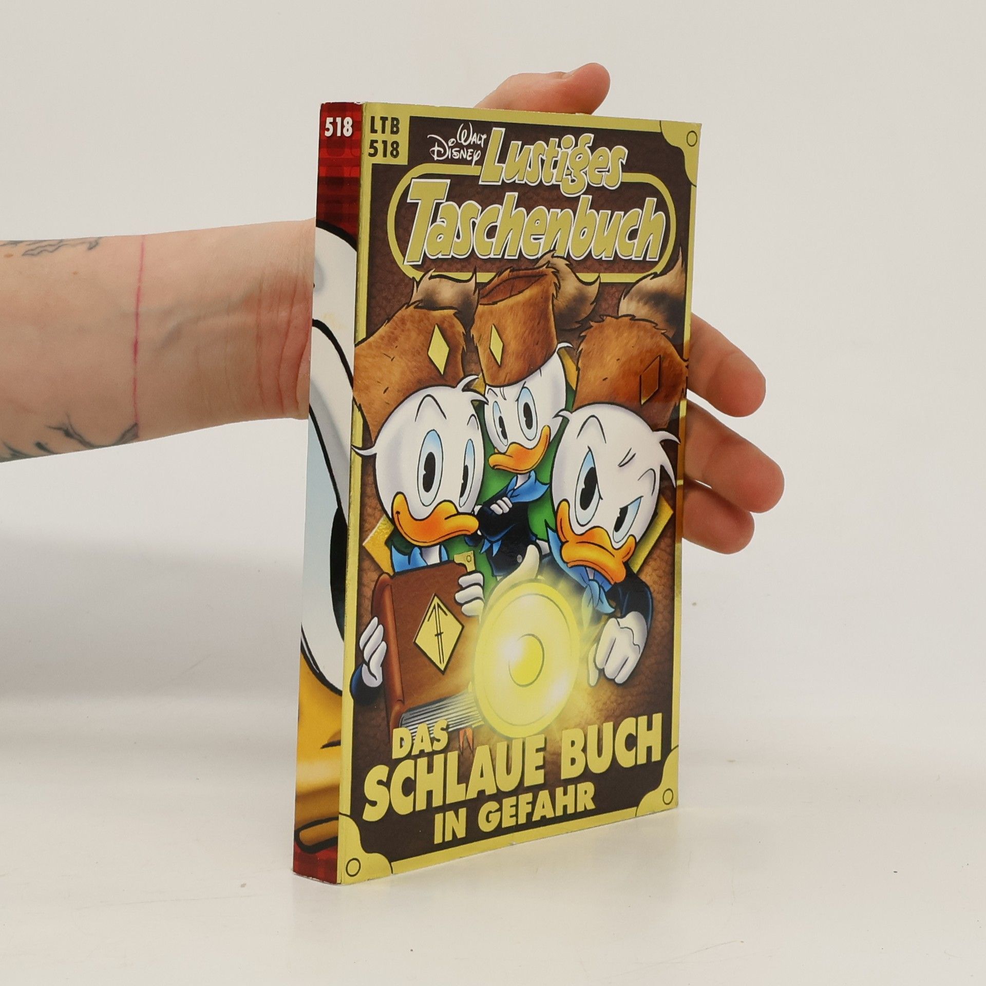 Walt Disney Lustiges Taschenbuch. Das Schlaue buch in Gefrahr