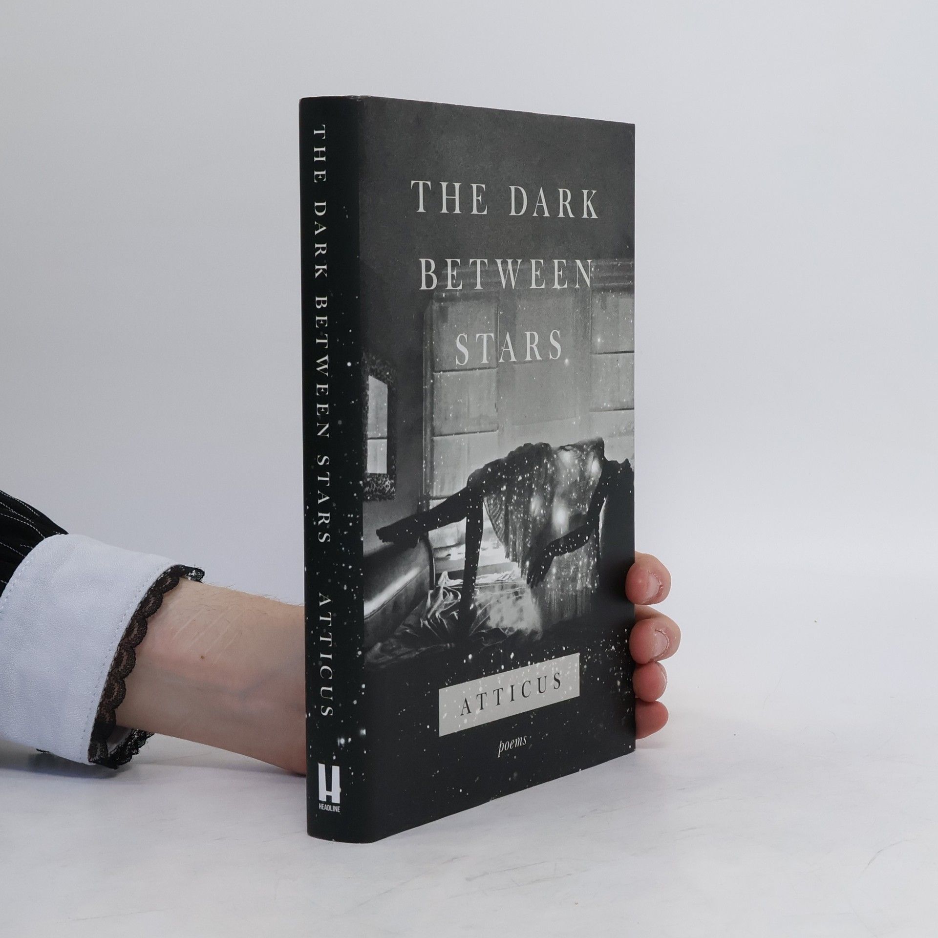 Atticus The dark between stars: Poems