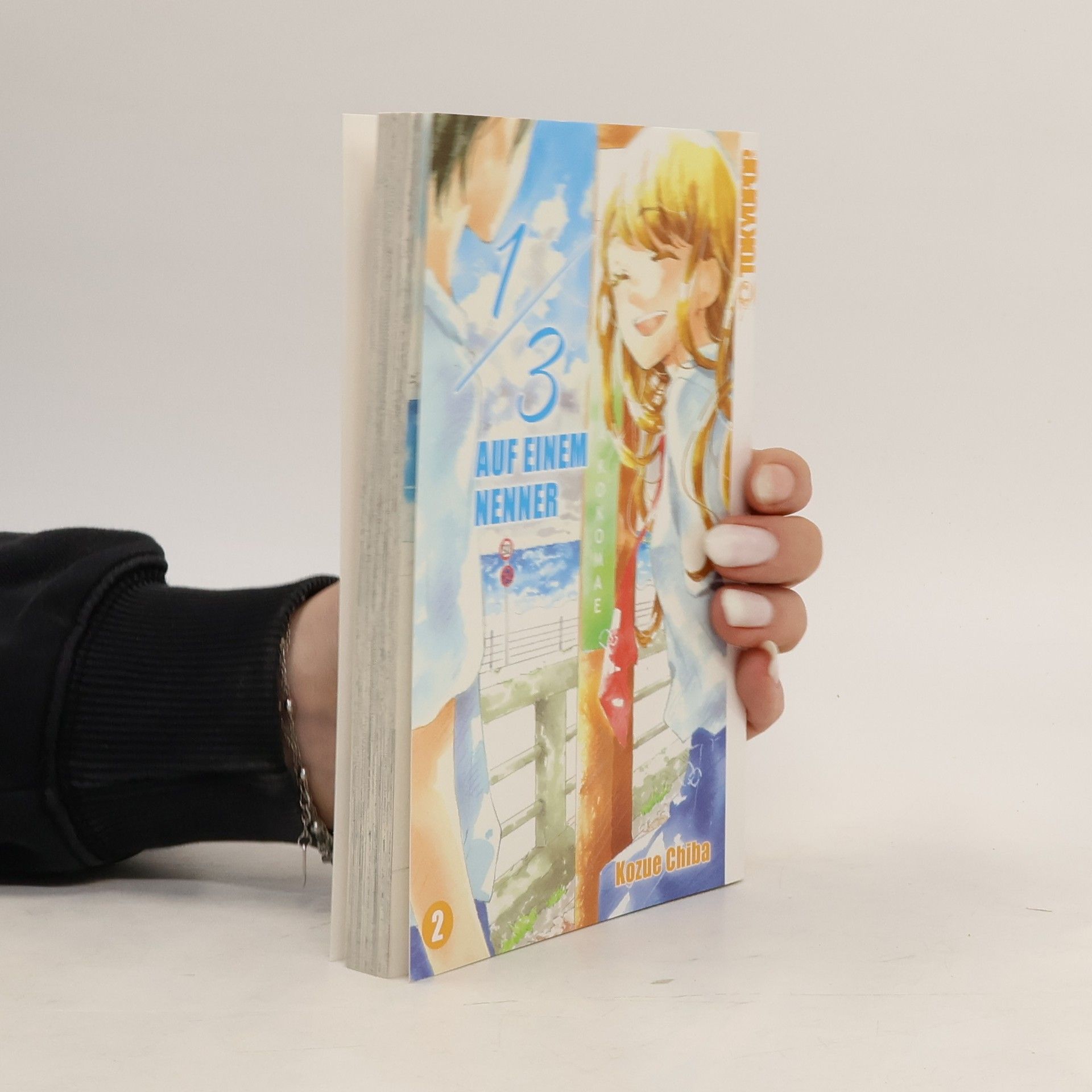 Kozue Chiba 1/3 auf einem Nenner 2