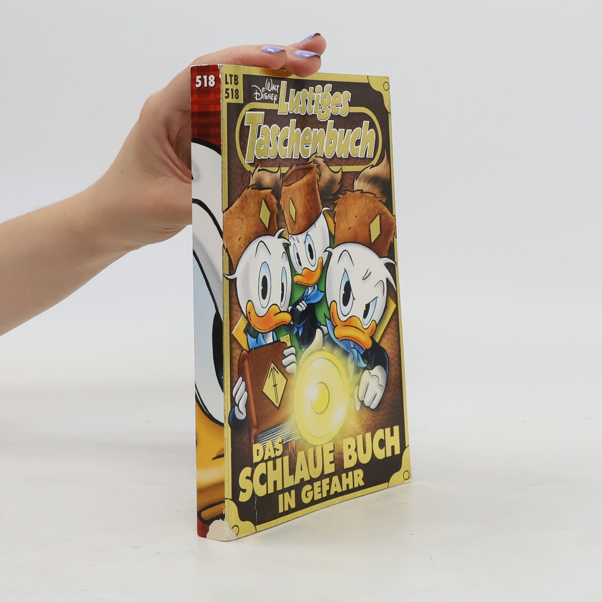 Walt Disney Lustiges Taschenbuch. Das Schlaue buch in Gefahr