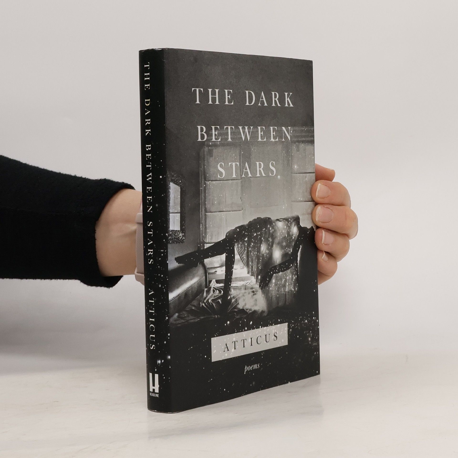 Atticus The dark between stars: Poems