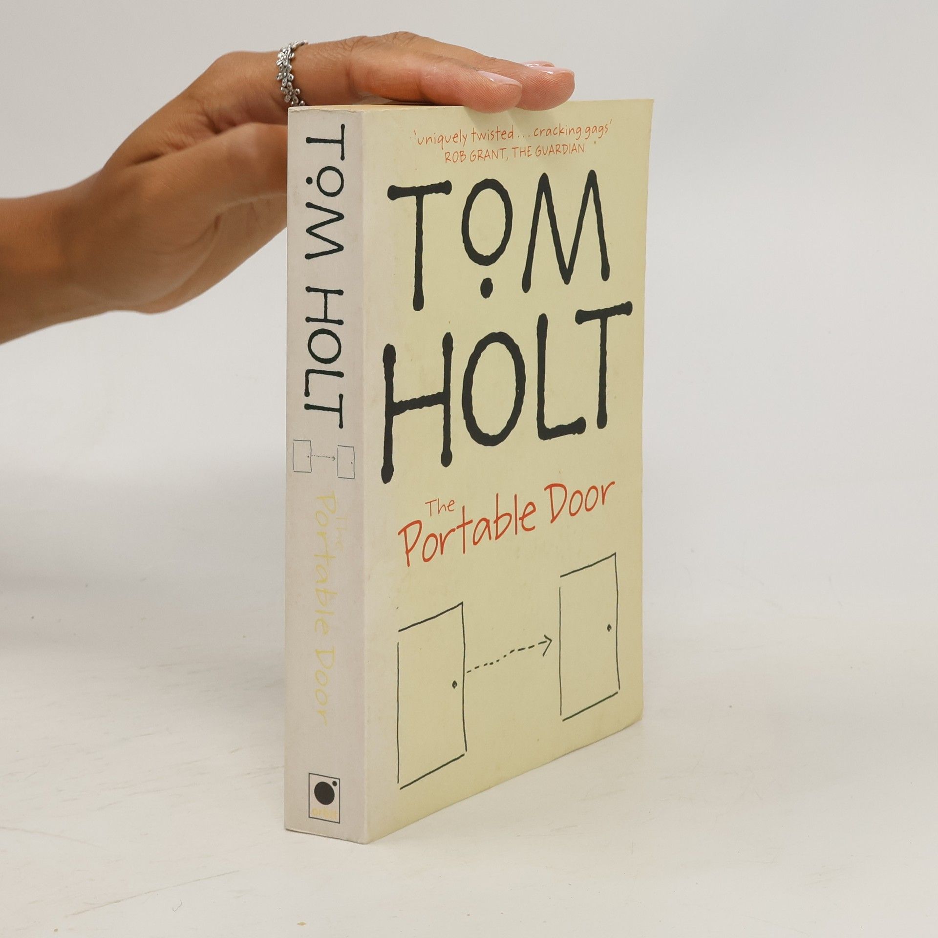 Tom Holt The Portable Door
