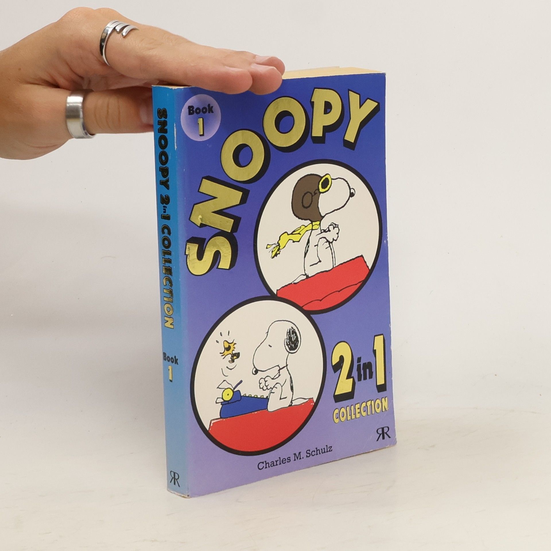 Charles M. Schulz Snoopy 2-in-1 Collection. Snoopy features as The Flying Ace; Snoopy features as The Literary Ace