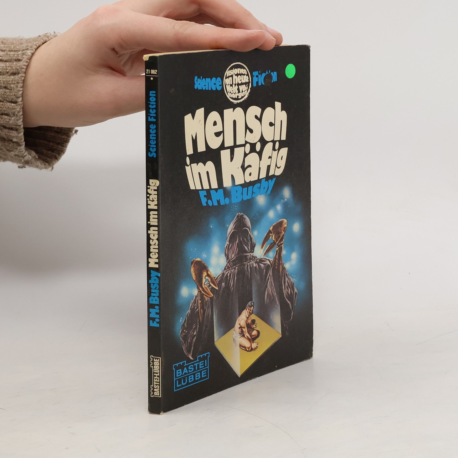 F. M. Busby Mensch im Käfig