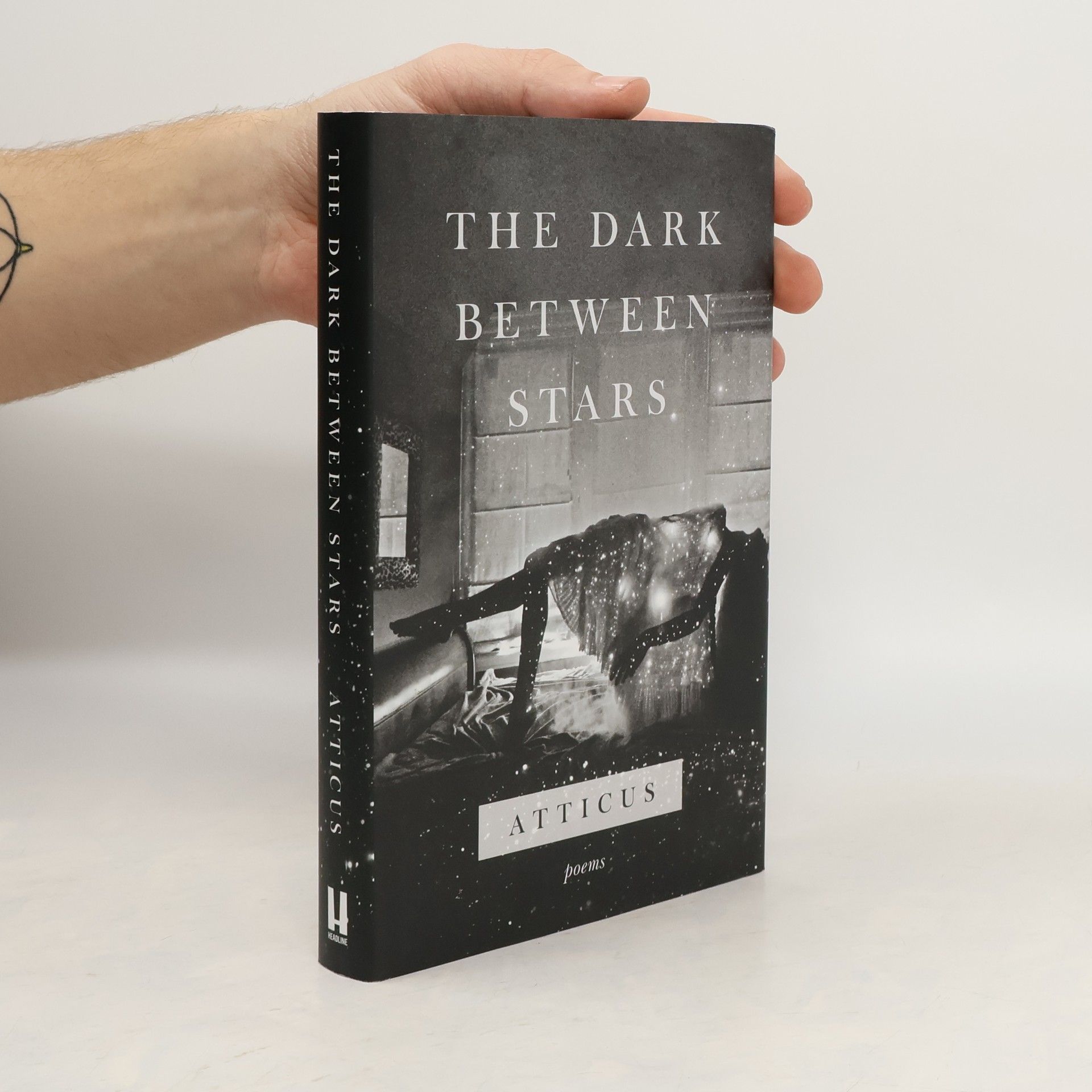 Atticus The dark between stars: Poems