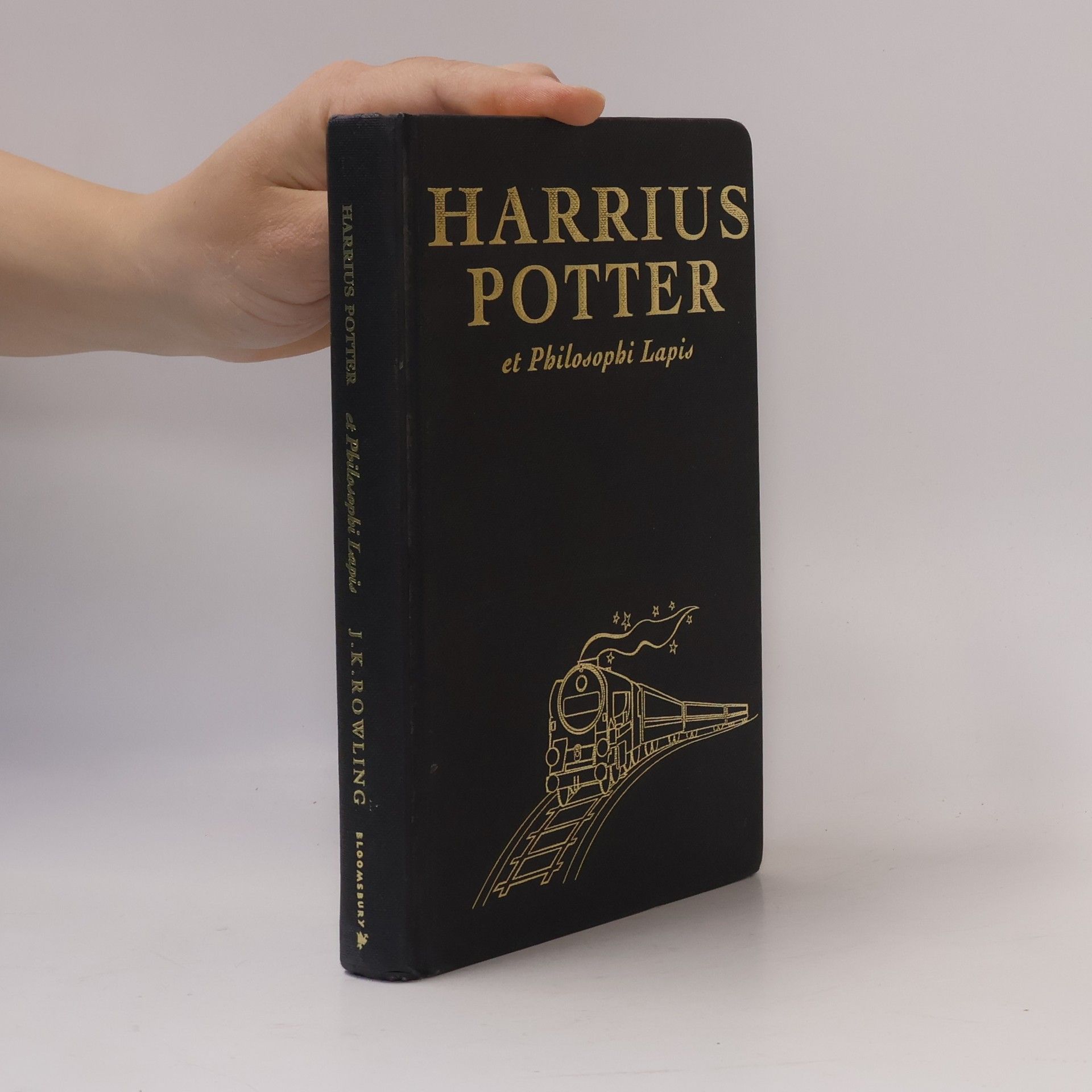 J. K. Rowling Harrius Potter et Philosophi Lapis