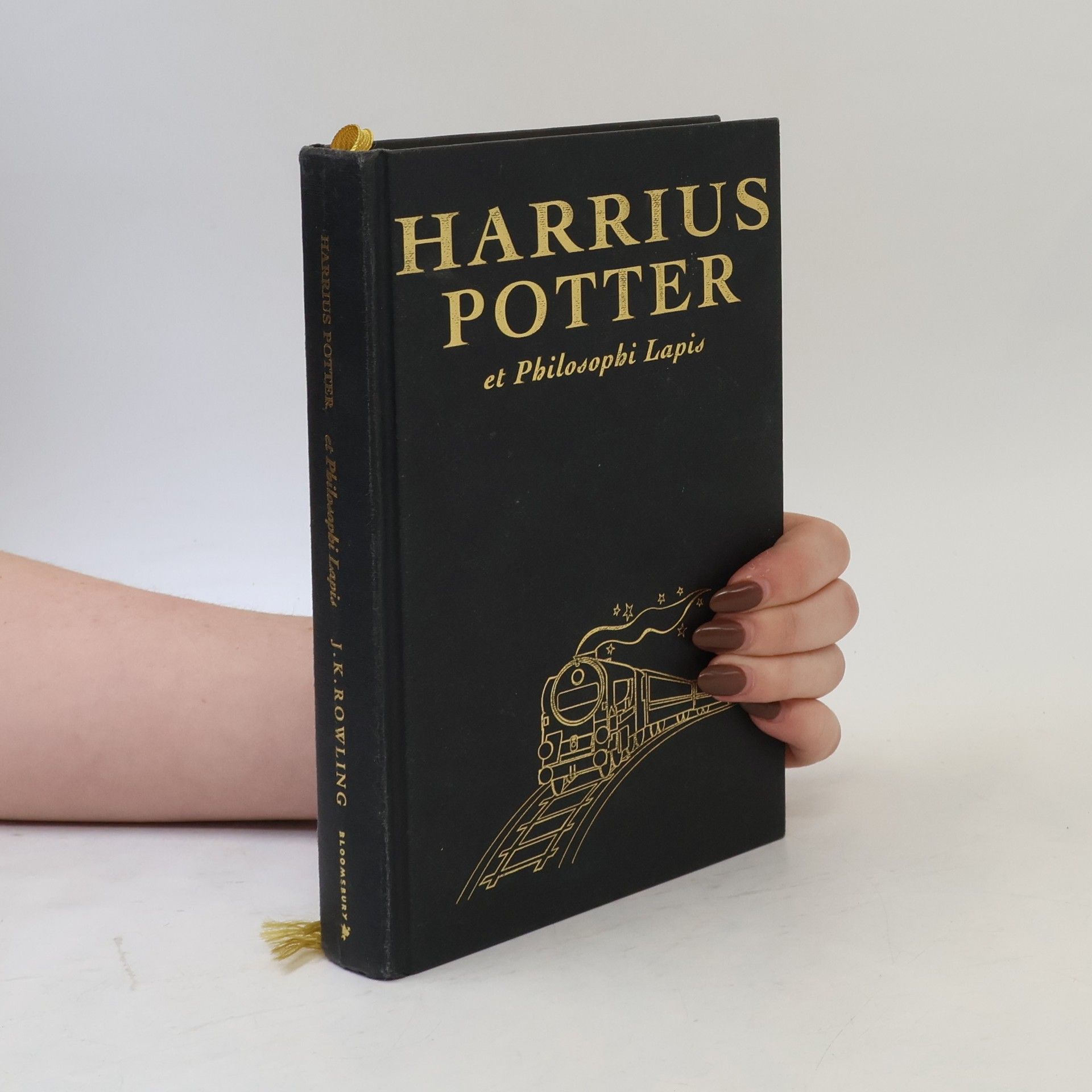J. K. Rowling Harrius Potter et Philosophi Lapis