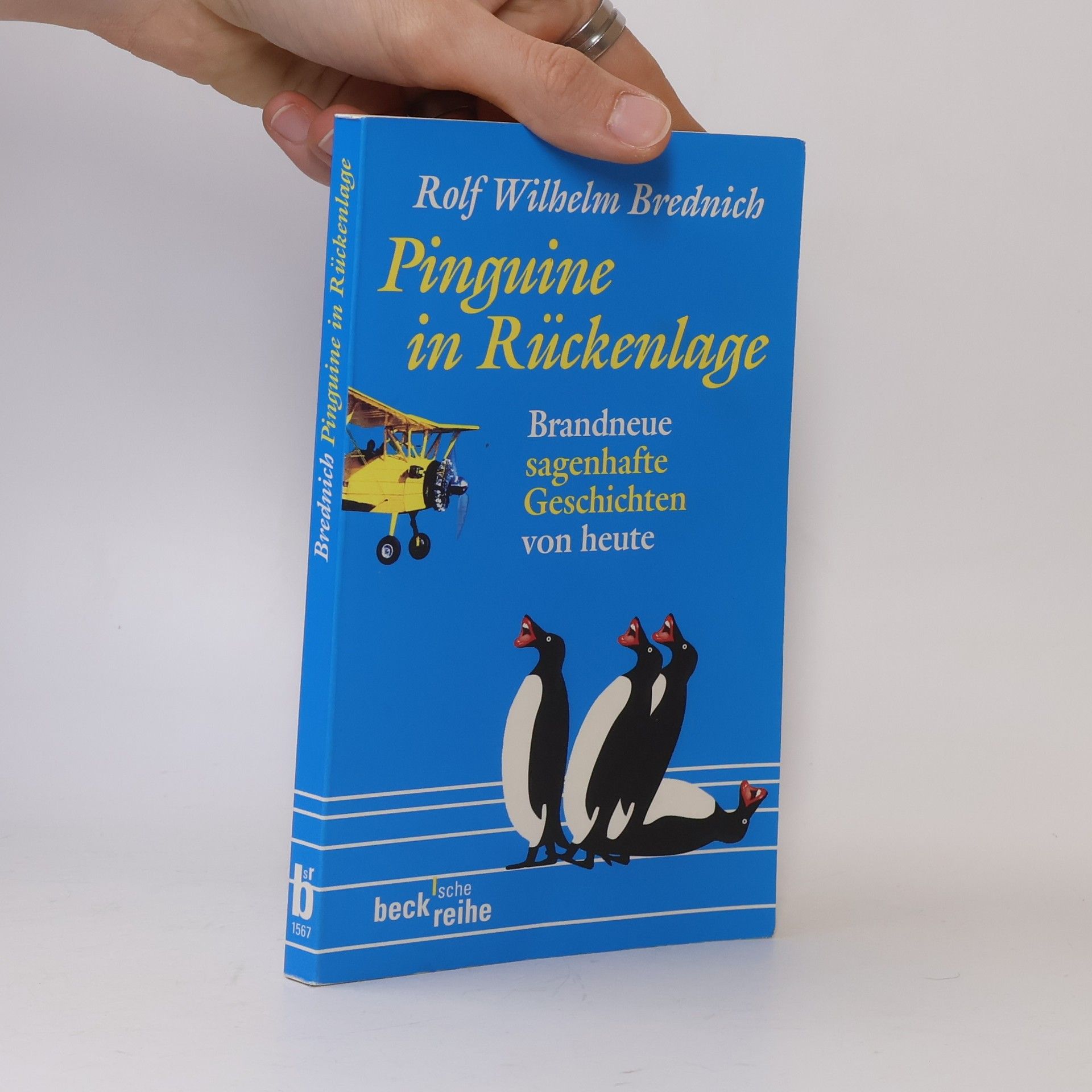 Rolf Wilhelm Brednich Pinguine in Rückenlage