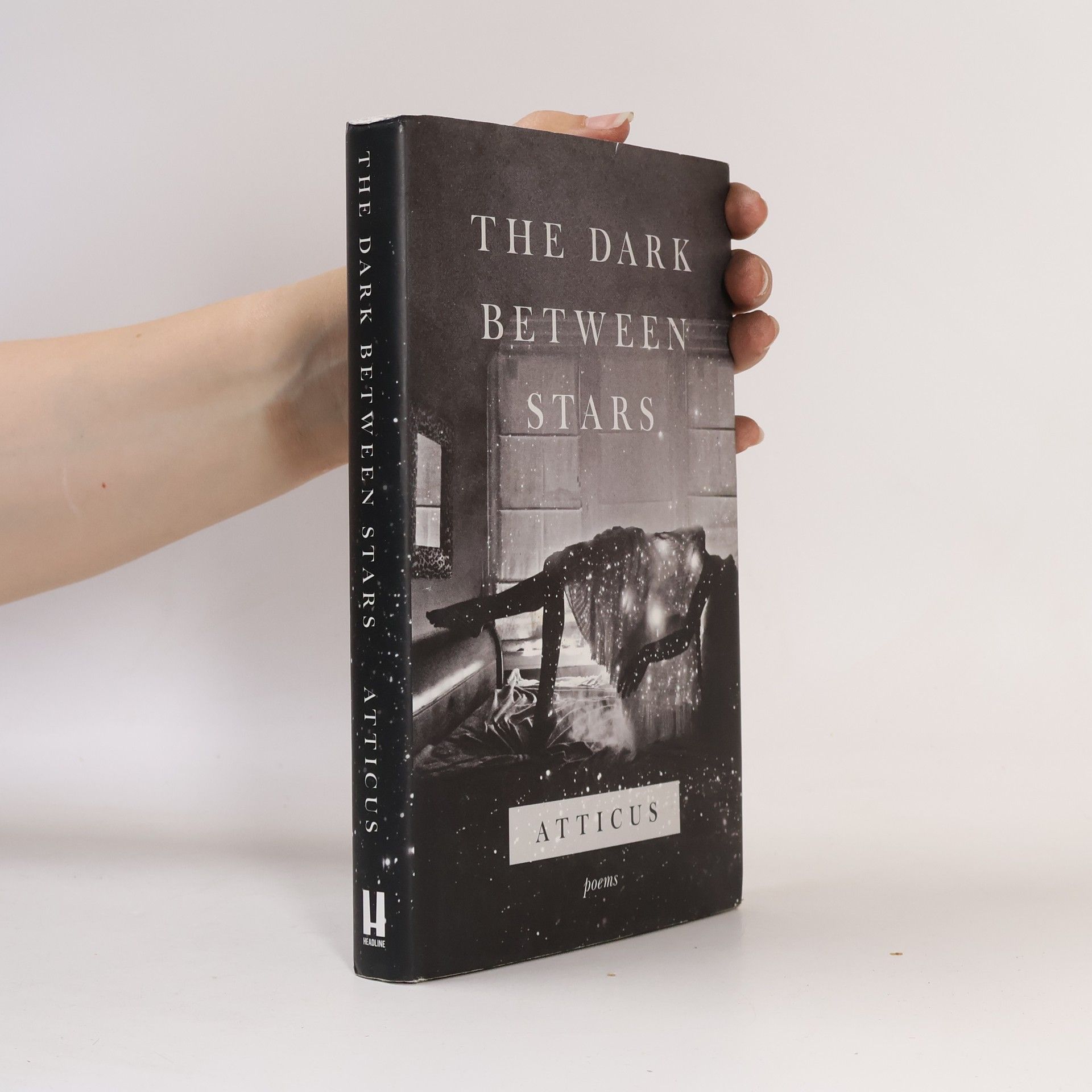 Atticus The dark between stars: Poems