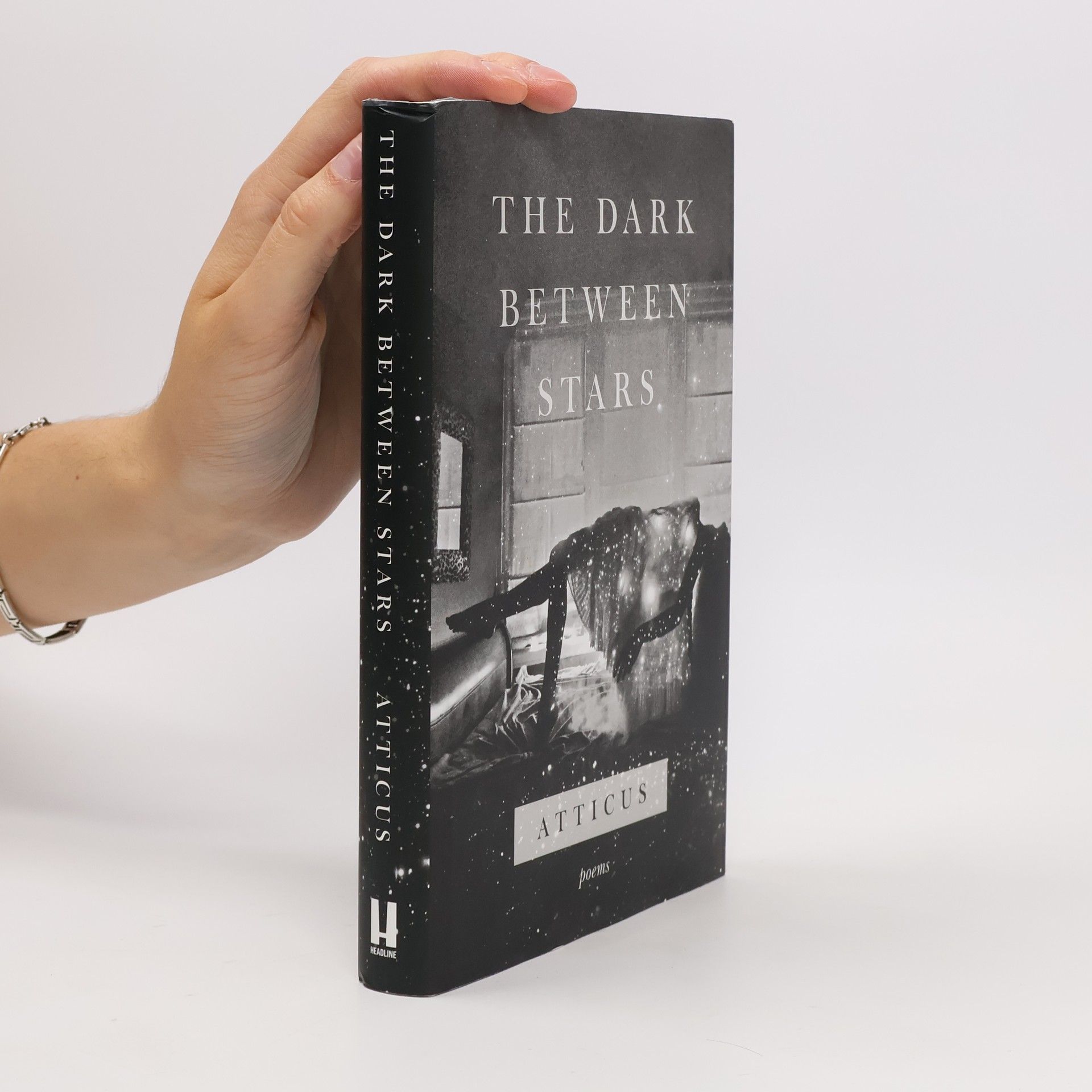 Atticus The dark between stars: Poems