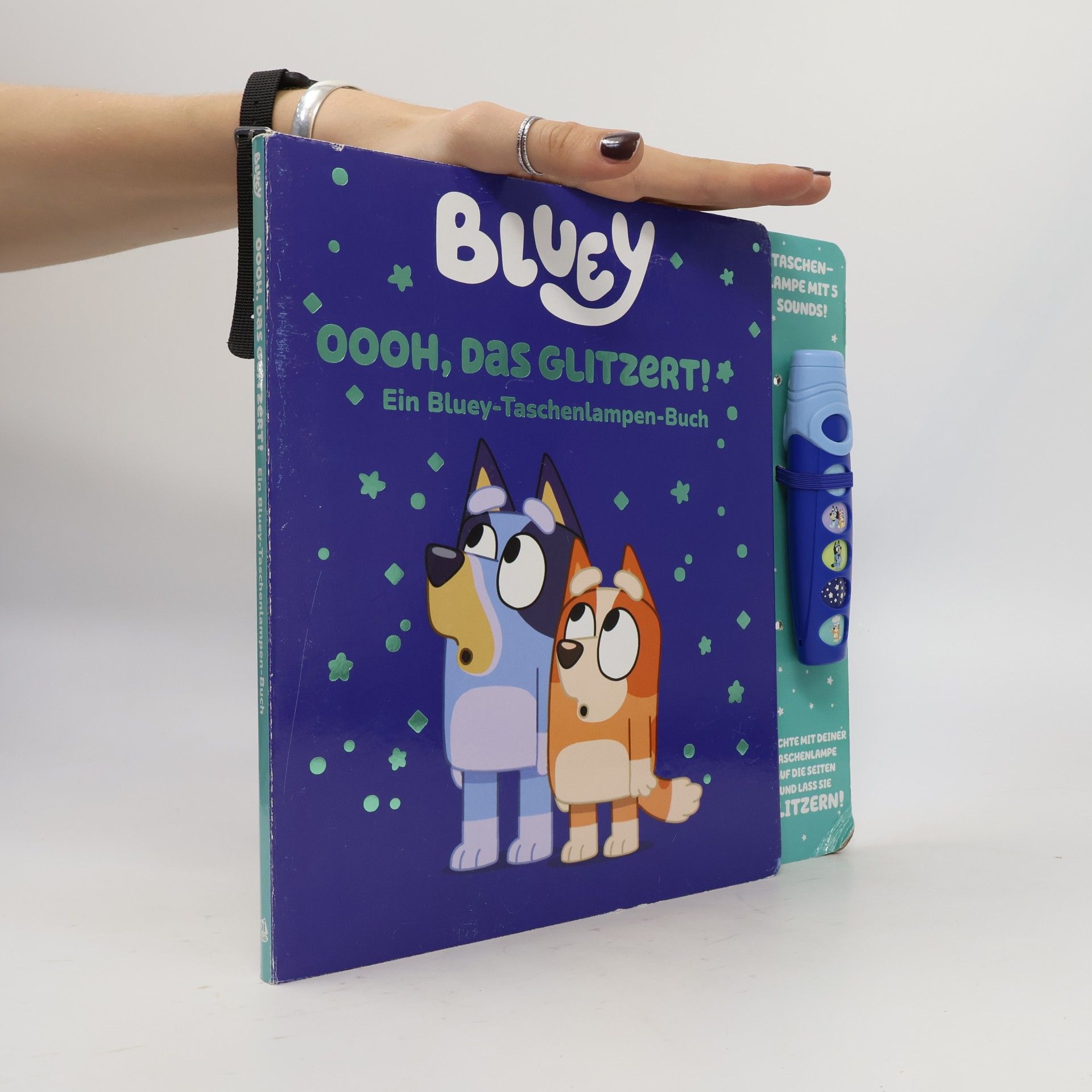Kolektiv autorů Bluey - Oooh, das glitzert! - Interaktives Taschenlampen-Soundbuch mit 5 Geräuschen und Glitzerseiten