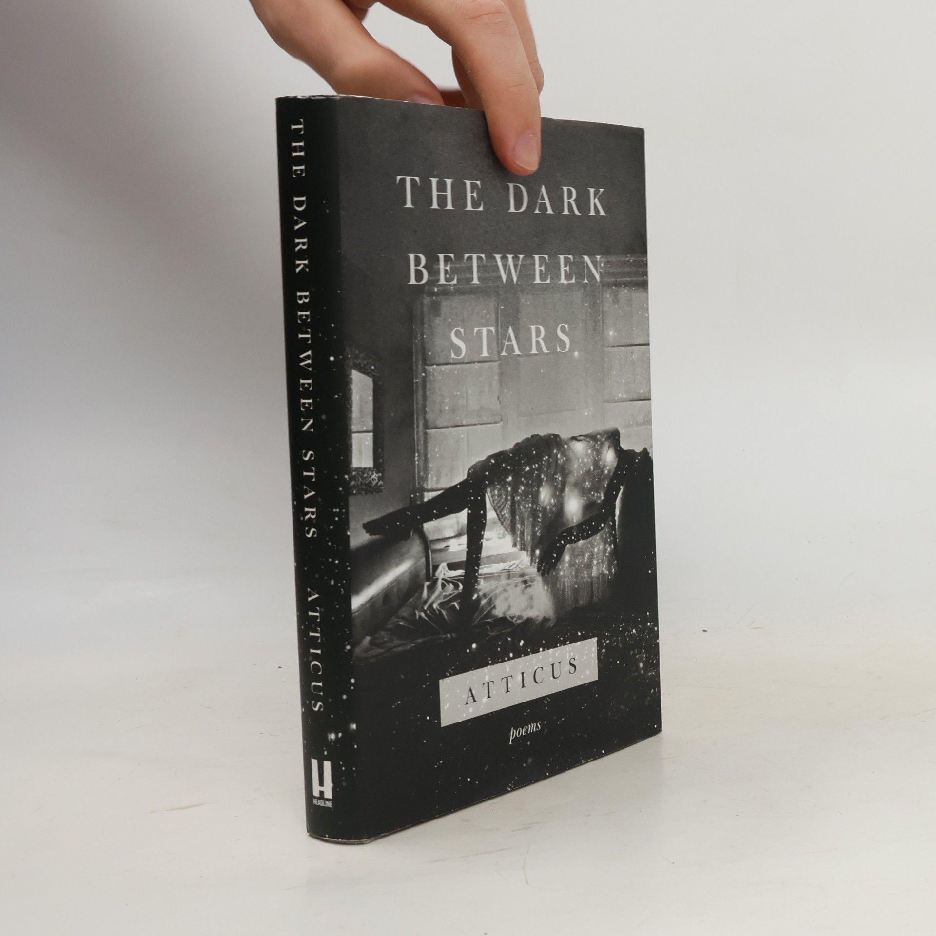 Atticus The dark between stars: Poems