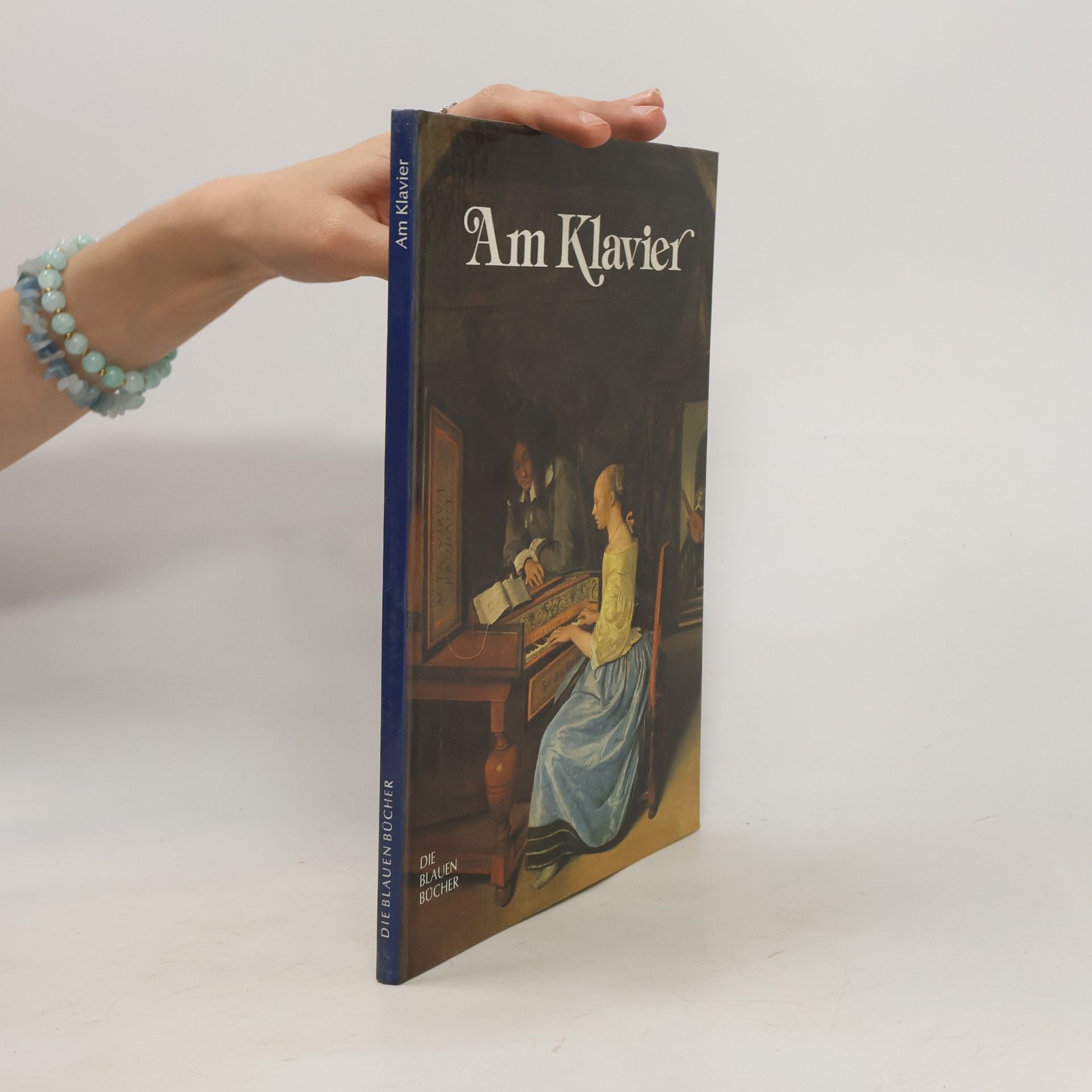 Die Blauen Bücher. Am Klavier
