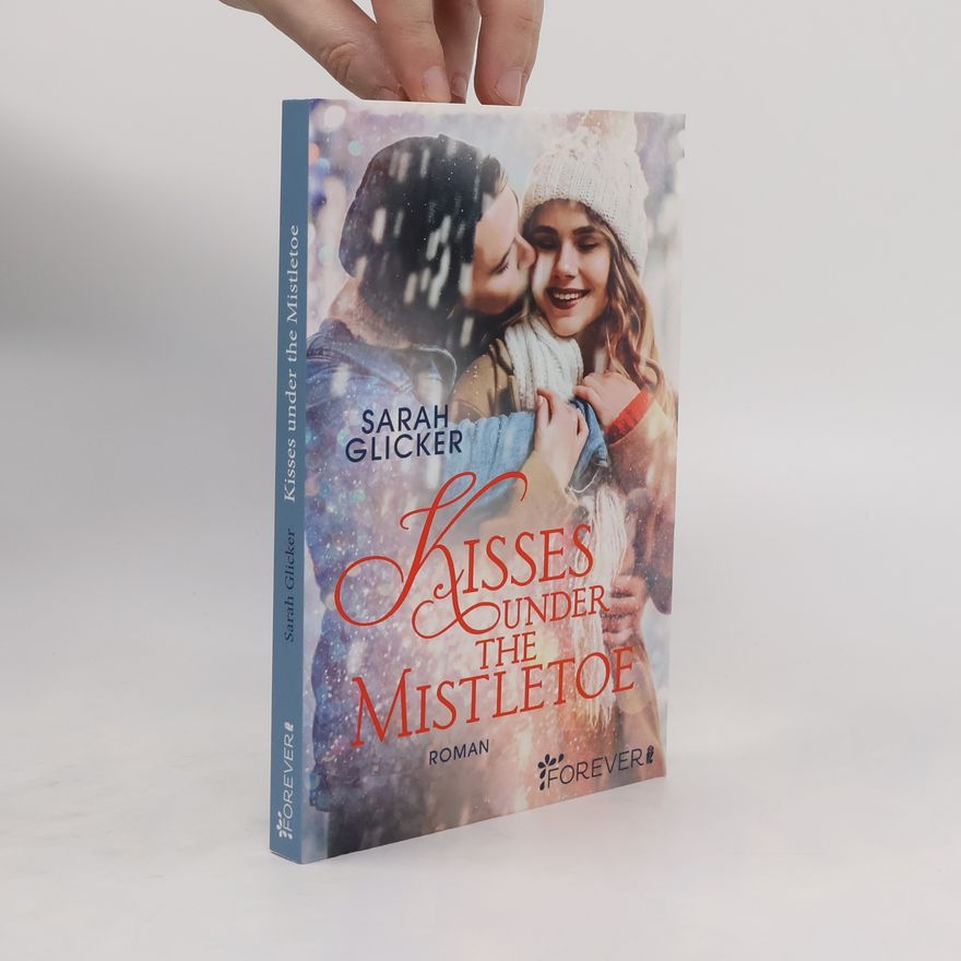 Sarah Glicker Kisses under the mistletoe